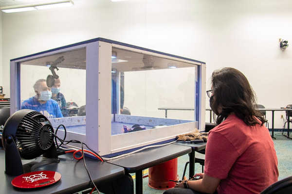 Jennifer Fabian (right), an engineering design technology student from Hershey, competes against the bot of Alex J. Barreto, who is pursuing a degree in electronics and computer engineering technology: robotics and automation emphasis.