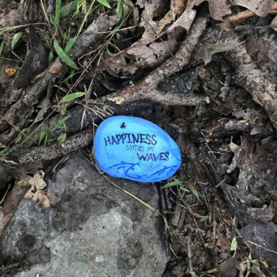 An inspirational rock, placed along the trail