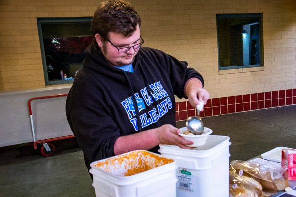 Schooley serves soup, prepared by the local American Rescue Workers.