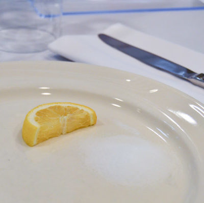 A lemon slice denotes the bitterness of loss.