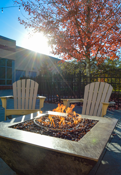 The Bush Campus Center fire pit issues a cozy invitation.