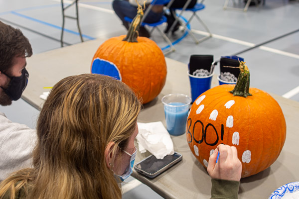 A host of ghosts adorns this Pumpkin Fest contribution, punctuated by an artist's steady hand.