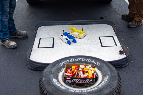 Remote-control cars await their next battle, alongside a uniquely automotive candy container.