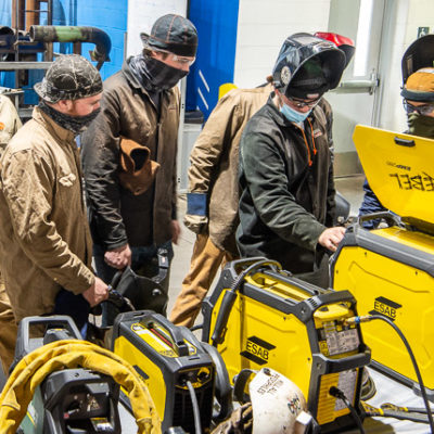 Welding students work with the ESAB Rebel EMP 285ic, a portable multiprocess unit.