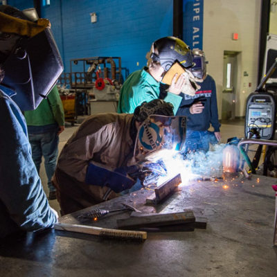 The three-phase ARISTO unit gets a tryout from students using flux-cored arc welding.