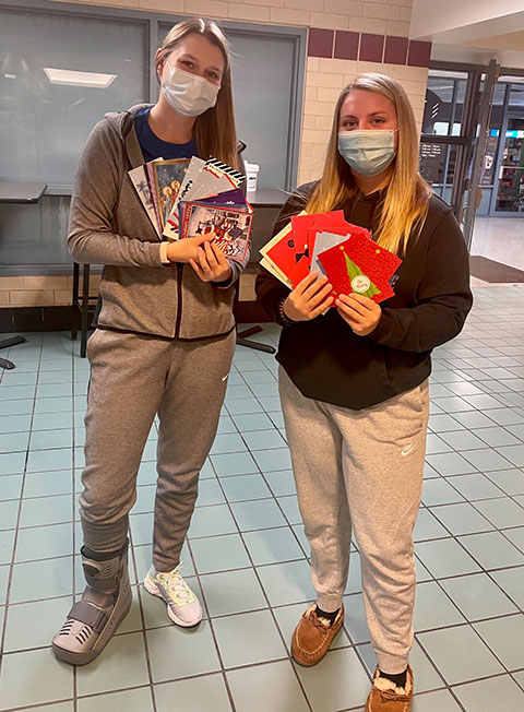 Basketball teammates Maci N. Ilgen (left), of Spring Mills, and Makaya Shadle, of Galeton, proudly display their off-court output. Ilgen is a nursing student; Shadle is enrolled in human services and restorative justice.<br />
