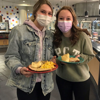 Friends enjoy each other's company, as well as home cooking at their "home away from home."