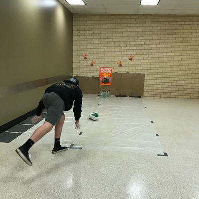 With a fresh-baked pumpkin pie on the line, a student bowler hopes his aim is true.