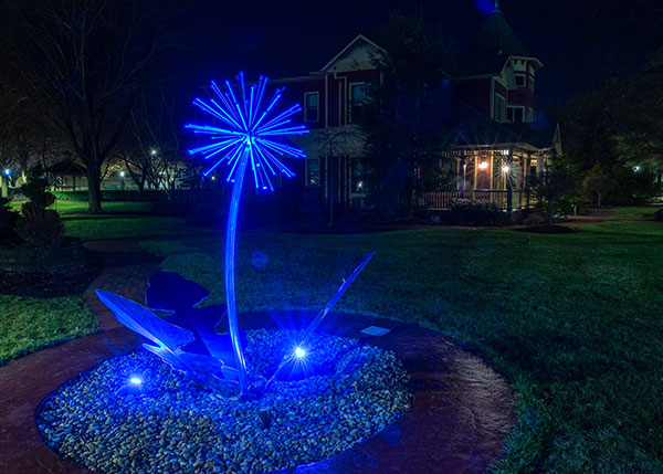 A dandelion sprinkler on warmer days, this attraction by The Victorian House is no less stunning when turning wintry blue.