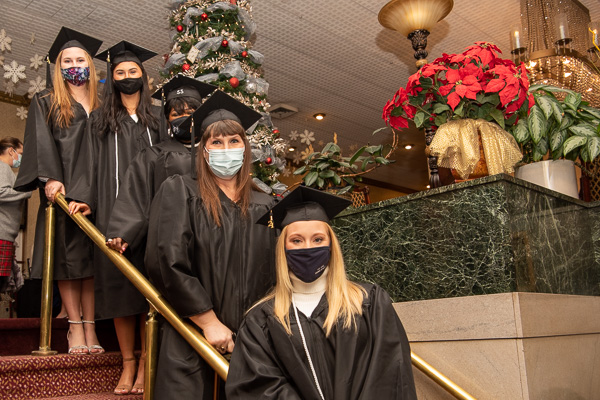 Leading the lineup are these five soon-to-be-graduates in human services and restorative justice, waiting out the rainy weather in the decked-out Genetti Hotel lobby.