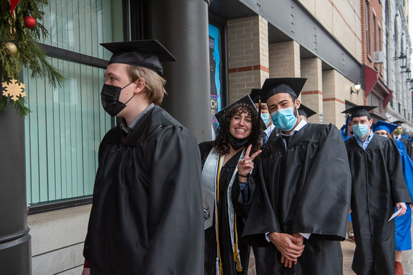 Student-athlete Emalie M. Marnati, a Wildcat volleyball player, can't conceal her excitement en route to a bachelor’s in residential construction technology and management: building construction technology concentration. Marnati already holds an associate degree (2020) in building construction technology. To her left, and graduating in the same four-year major, is Nicholas W. McFarland.