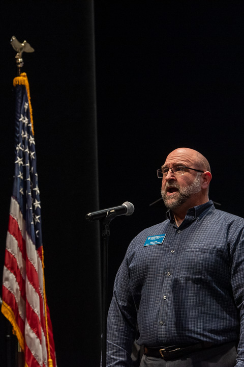 Don J. Luke, the college's director of facilities operations, sings the national anthem a cappella.