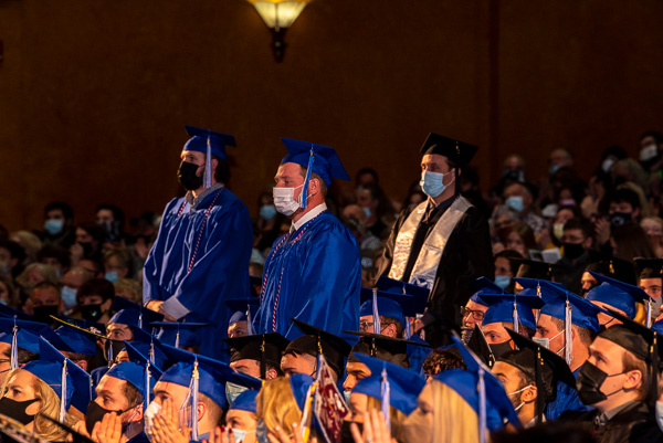 Veterans, among 250 currently enrolled at Penn College, stand for recognition from the appreciative crowd. 