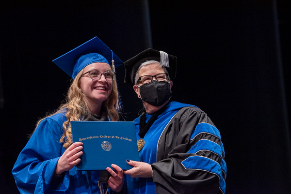 The president famously delights in every interaction, no doubt including this one with a beaming Jordyn T. Mitchell, baking and pastry arts.