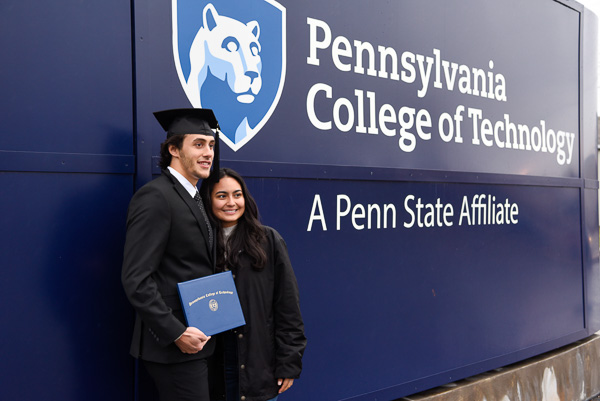 Making a memory with his girlfriend is Byron S. Matthews, business administration: marketing concentration.