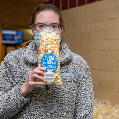 A good sport (befitting the event's goodwill), welding & fabrication engineering technology student Jayna K. Vicary indulges a photographer's "corny" suggestion. 