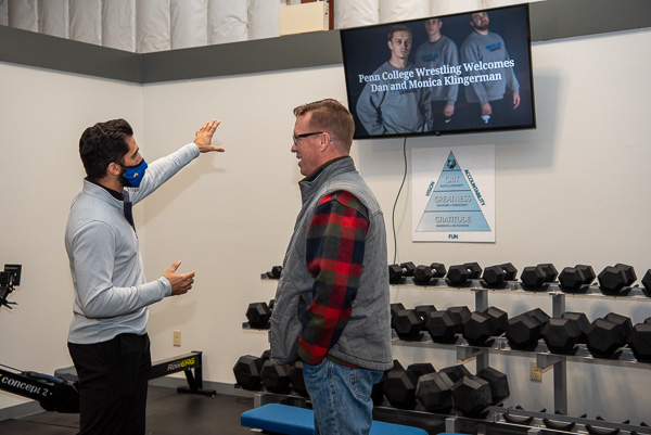 Miller motions to the monitor which offers the versatility of welcoming recruits to campus, displaying daily team practice plans or watching films. 