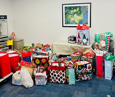 Collected gifts fill Student Engagement's workroom.