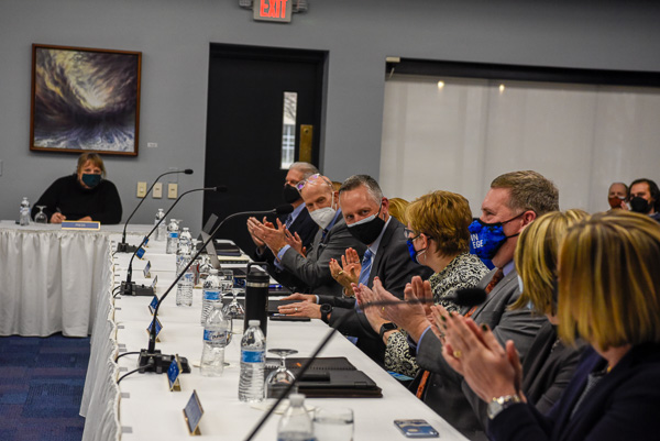 President's Council applauds Reed after the board's unanimous approval of his nomination.