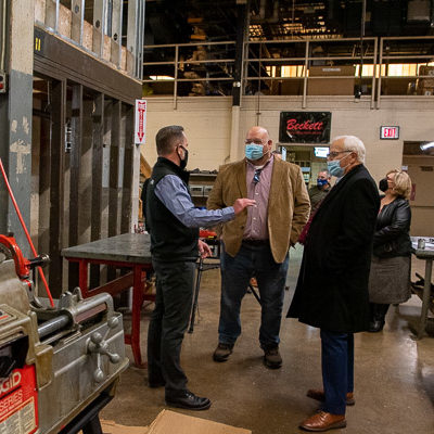 Jason W. Killinger (left), assistant professor of HVAC technology, leads the group on a Carl Building Technologies Center lab tour.