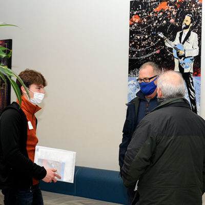 A veteran of the Penn College NOW dual enrollment program as a South Williamsport Area Jr.-Sr. High School student, Logan R. Ogden attended Open House to learn more about building construction technology and construction management. With him are his father, Robert C. (center), facilities assistant lead person for General Services; and Clifford J. Jones, instructor of building construction technology, concrete and masonry.