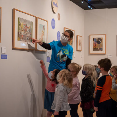 Sporting her “The Poky Little Puppy” T-shirt, Lutz leads the next generation of art enthusiasts through the gallery exhibition.