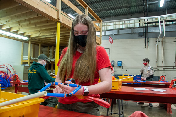 This Scout, tightening a fitting in the plumbing session, is on track to become the first female Eagle Scout from the Susquehanna Council, according to Scout leader Chuck Mertes, a plumber who, appropriately, was stationed in the HVAC/plumbing lab.