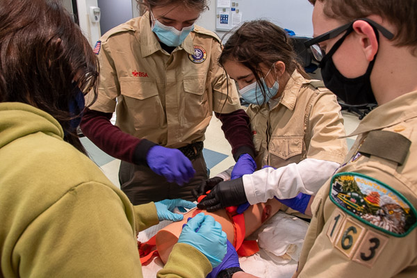 In the Paramedic Lab, Scouts practice applying a tourniquet in pursuit of a First Aid merit badge.