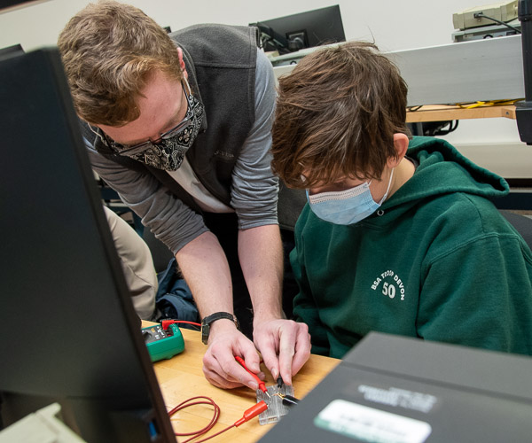 Engineering design student Stephen C. Brodecki, who’s also taking the Robotic Applications course, is among a pair of Penn College Eagle Scouts who lent hands-on help to scouts pursuing an electronics merit badge.