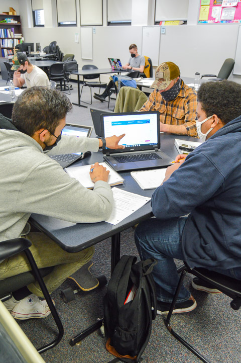 Tutor Dhruv Singh (foreground), of Dayton, N.J., studying automotive technology management, assists Jacob A. Jett, enrolled in electrical construction, who brought along fellow Williamsporter Nathaniel E. Anselmo, a welding technology student.