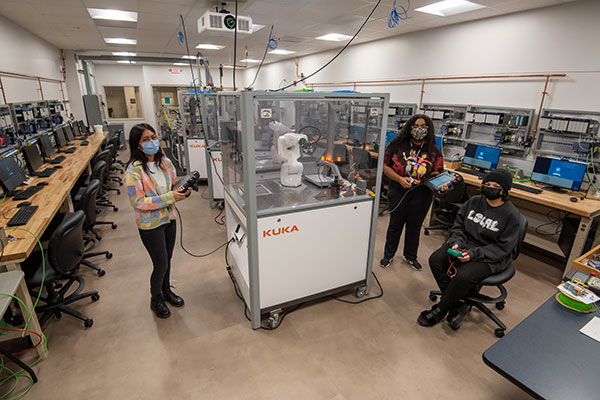 Three first-year female students are making their mark studying robotics and automation at Pennsylvania College of Technology. From left, are Angelica J. Parrocho, a native of the Bronx, N.Y., who resides in Jersey Shore, Pennsylvania; Kayla M. Figuereo, of Edgewater Park, N.J.; and Ava A. Birotte, of Sunbury, Pennsylvania. Birotte and Figuereo are pursuing bachelor’s degrees in automation engineering technology: robotics and automation, and Parrocho is seeking an associate degree in electronics and computer engineering technology: robotics and automation emphasis.