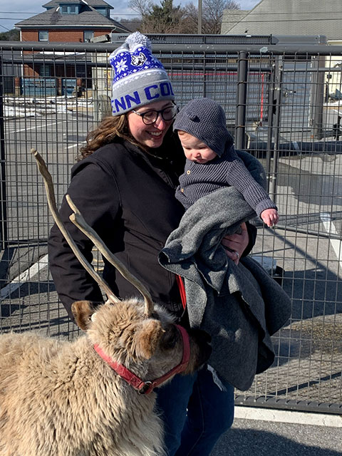 With equal parts enthusiasm and wariness, Meghan R. Delsite Coleman, assistant director of student engagement, and daughter get acquainted with a visitor. (Photo provided)