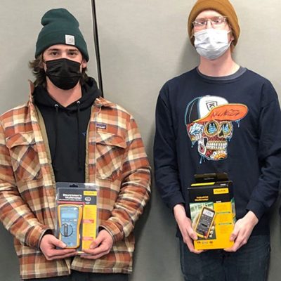 First-place finisher Curtiss R. Gay (right) and second-place winner Sam Cole will represent Penn College in national SkillsUSA competition in June. They are pictured holding Fluke multimeters, donated by New World Aviation in Allentown and altogether valued at about $1,000.