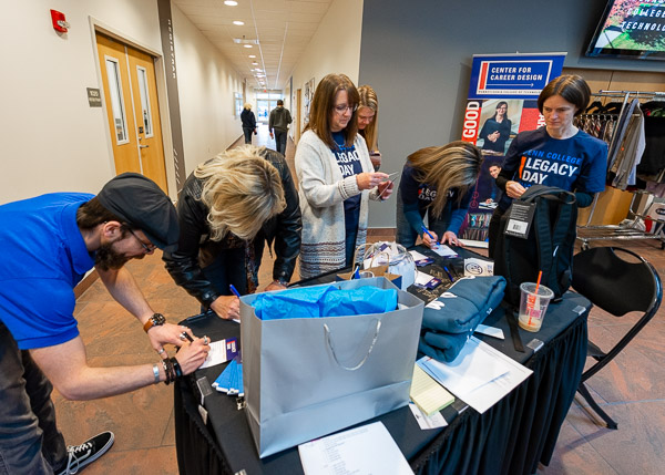 Employees register for door prizes upon check-in.