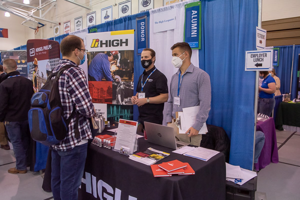Welding alumnus Adam J. Steppe (at center in black mask) was among the many graduates recruiting for their companies. The High Steel Structures welding engineer earned three Penn College degrees: welding, ’99; welding technology, ’11; and welding and fabrication engineering technology, ’13.