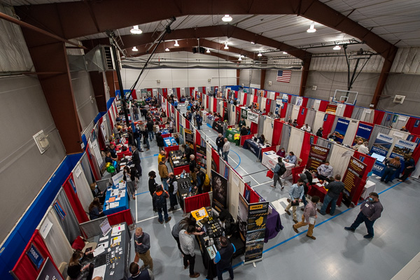 Employers and job-seekers, each as eager as the other to make connections, fill the red-white-and-blue Field House venue.