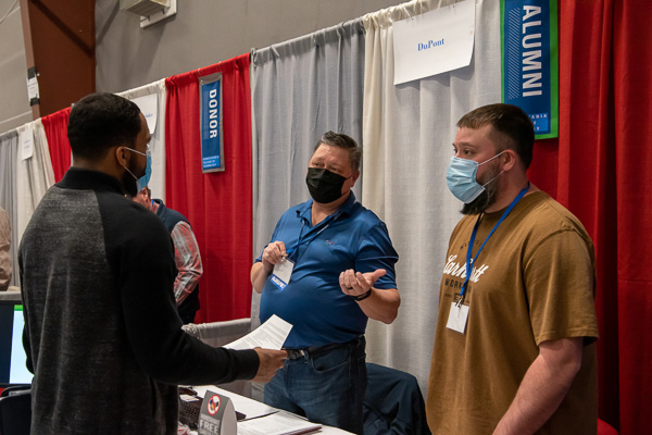 Todd A. Bassett (center), '92, electronics engineering technology, discusses DuPont careers with Zavon M. Harris (left), an electrical technology student from Williamsport who already holds a degree in mechatronics engineering technology.