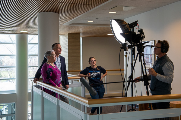 Gilmour and Reed prepare to record a major announcement, assisted by Rusczyk and Christopher J. Leigh, video producer.