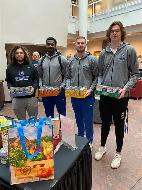 These student-athletes are as adept at helpfulness as they are at hoops, delivering contributions to the campus food pantry ...