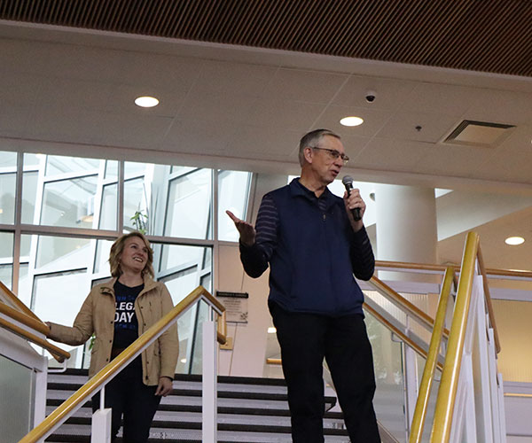 Kline smiles at remarks by John M. Confer, a 1975 alumnus and chair of the Penn College Foundation Board of Directors.