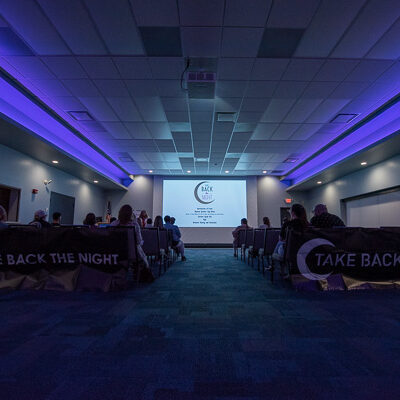 Survivors and supporters gather under the glow of the PDC’s Mountain Laurel Room lights.
