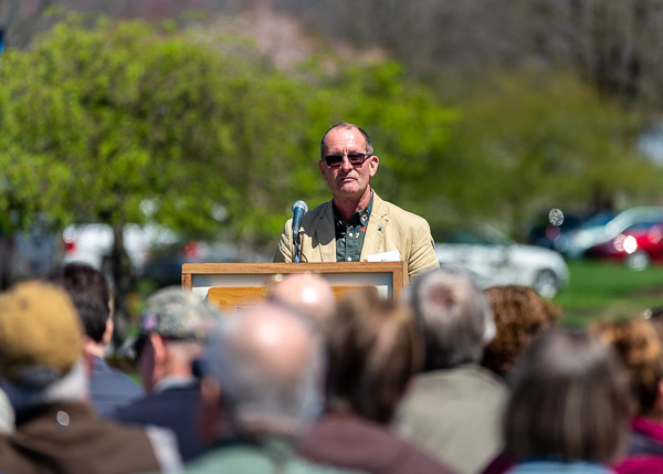 Alumnus Burger urges the Earth Day crowd to 