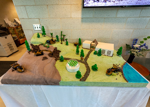 Conversation flowed naturally as acquaintances were renewed, and among the things most talked-about was this commemorative cake by student CC Nicole Hawkins. Hawkins, who estimated that her creation took at least 90 hours to complete with the help of first-year baking students, incorporates a number of ESC components: the main building, heavy equipment, the pond and plentiful trees – even the hydroponic lettuce grown in the greenhouse!