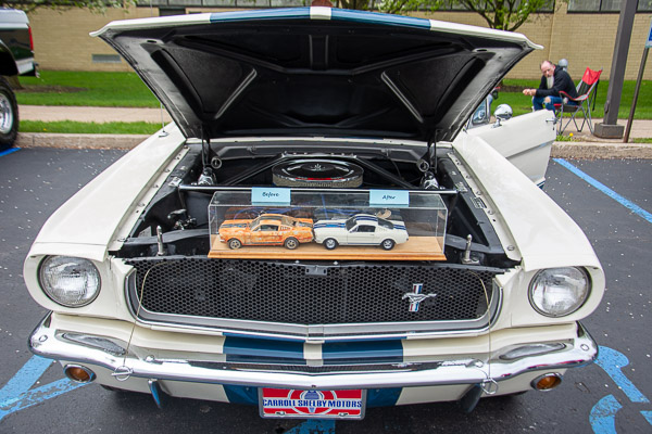 Before-and-after models are displayed within this iconic Carroll Shelby Ford Mustang.
