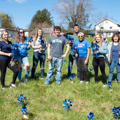 The Penn College contingent gathers with Margie Sauers (right), a caseworker with Lycoming County Children & Youth Services.