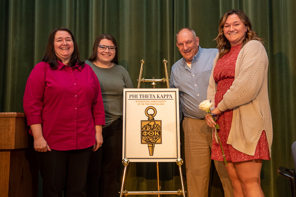 Christine Limbert (right) shares a fun moment with her parents and sister, Jessica (who assumed PTK membership as a general studies student six years ago to the date). Christine earned an associate degree in architectural technology last year, and is in the final year toward her bachelor's.