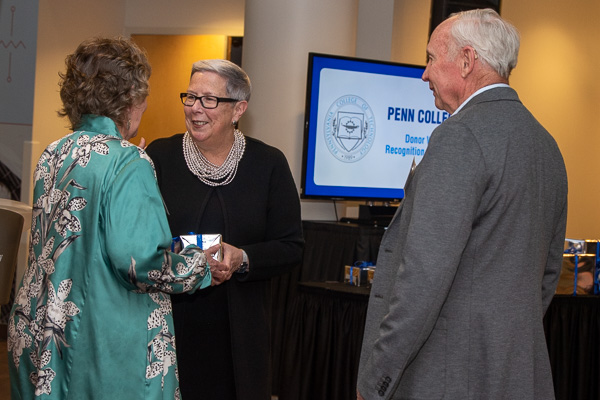 David and Marilyn Seeling (daughter of Kenneth E. Carl, former president of Williamsport Area Community College and director of Williamsport Technical Institute), share a happy moment with Gilmour. The Seelings attained an Ambassador's Society level of giving this year.