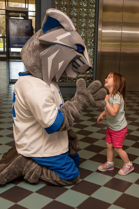 “Wildcat!” this youngster yelled, as she spotted the college mascot in the CC lobby and – after handing off her ice cream cone – ran for hugs and high-fives.