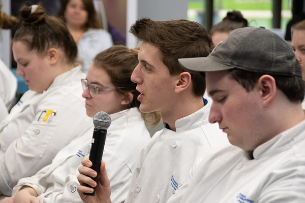 Caleb J. Stemler, a baking and pastry arts student from Jersey Shore, poses a question.