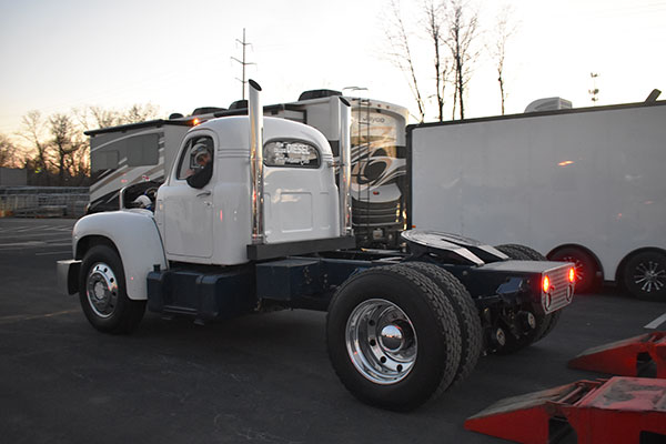 His aim is true! Welshans backs the drag truck up onto the lowboy.